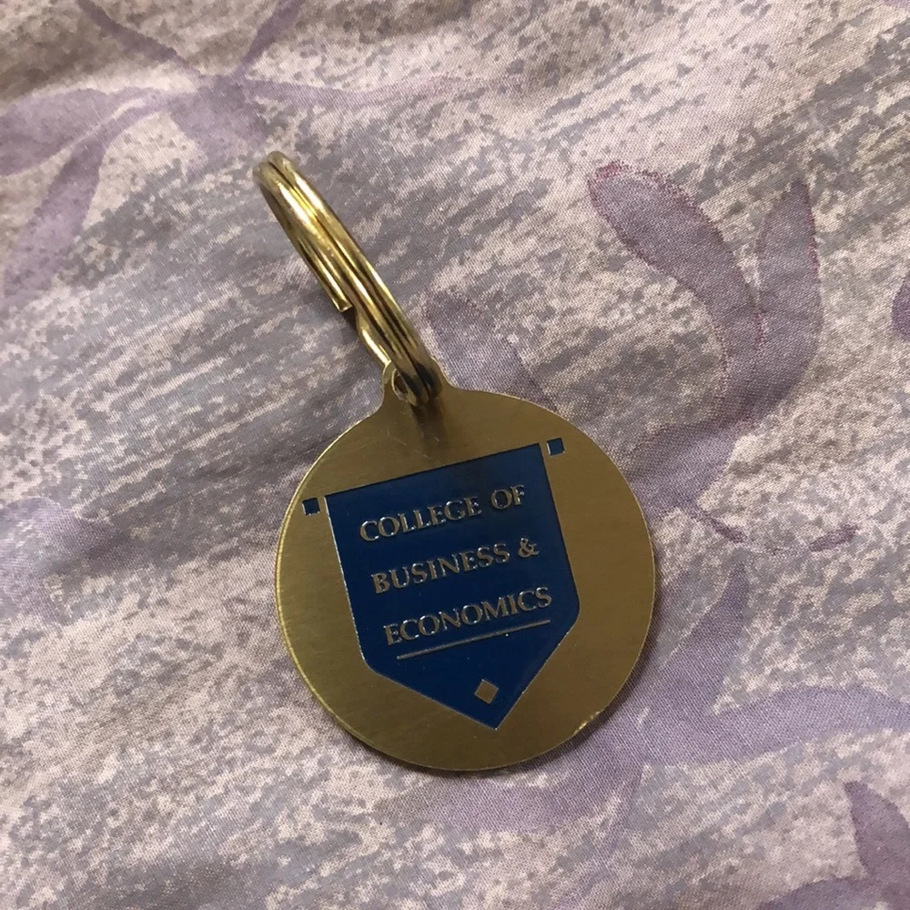 University of Delaware bronze College of Business and Economics keychain. New.